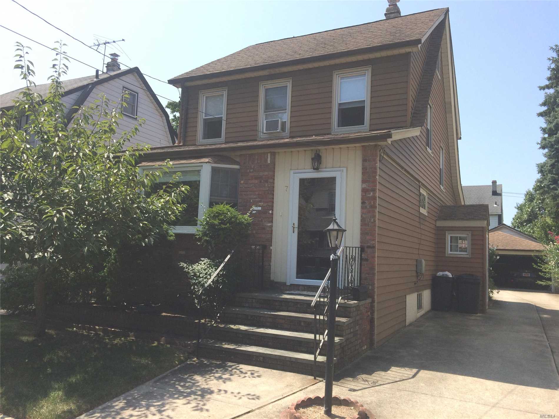 Mint Colonial Located On Quiet Street In Lynbrook . This House Is Move-In Condition And Features 3 Bedrooms + A Full Finished 3rd Floor Attic. Rear Screened Porch Overlooks 2 Car Garage & Manicured Yard. Walk To Lirr, Shopping, & Worship...