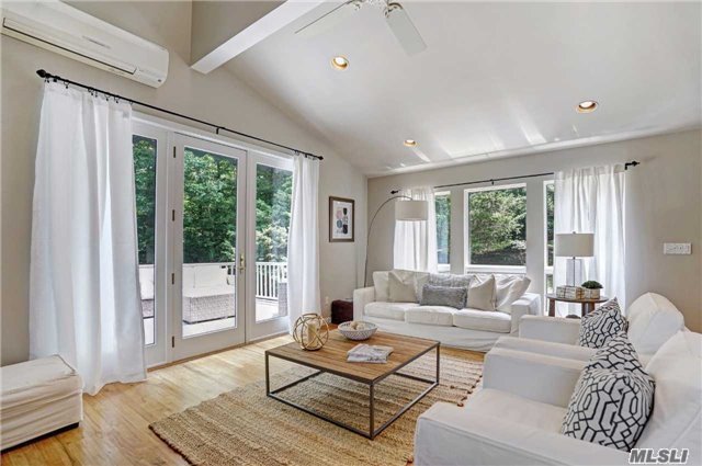 Exquisite North Fork Getaway In Remarkable Private Setting With Open Floor Plan And Natural Light Throughout, Including Two Spacious Bedrooms, Two Full Bathrooms, Bonus Loft And Wraparound Multi Level Decking With Seasonal Waterviews And Shed. Walk To Beaches, Restaurants And Marinas From This Truly Turn Key Gem!