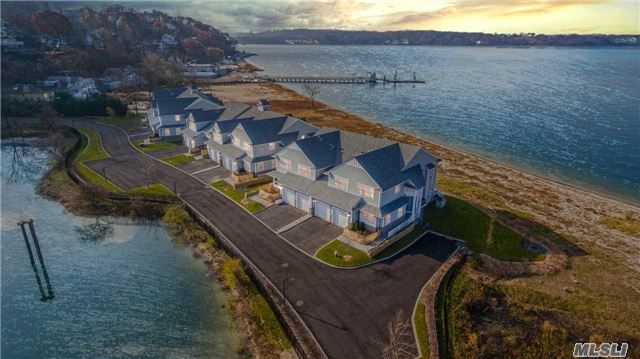 Extraordinary Design And Contemporary Luxury Describes This Waterfront Townhouse W/Spectacular Views. Sundrenched Open Flr Plan Blending State Of The Art Kitchen, Dining & Lvg Rm W/Gas Frplce. Plus Den/Ofc. French Drs. Lead To Spacious Deck & Private Beach. Master W/French Drs. & Luxurious Spa Bth W/Rad Ht., Oak Flrs, Finest Millwork, Humidifier System. Gated Community. Virtual Staged. Hampton&rsquo;s Alternative, Resort Style Living!
