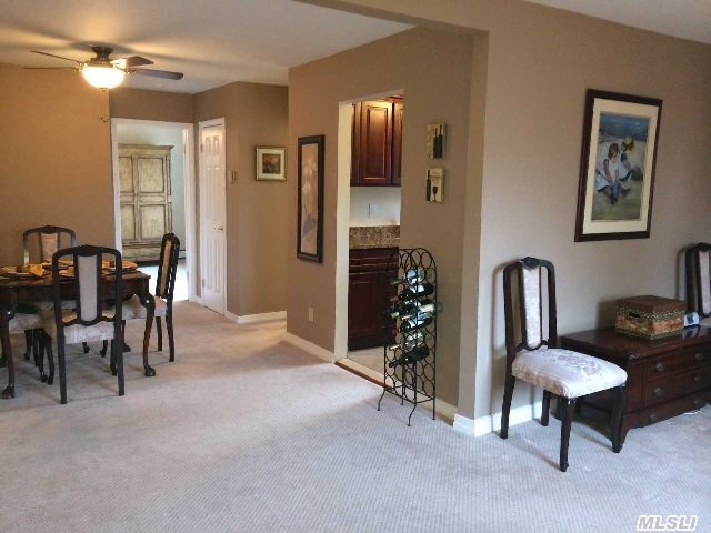 Bright & Sunny Upper 1 Br Unit W/ Sw Exposure.  New Kitchen W/ Ceramic Tile,  Cherry Cabinets W/ Whisper Close Drawers,  Crown Moldings,  Granite Counters & Backsplash,  Under-Mount Stainless Steel Sink,  & Appl. Lr W/ Hunter Douglas Cherry Blinds. Dining Rm. Full Bath,  Br W/ Crown Molding,  Lg. Closet. New Steel Door & Storm Door To Spacious Deck. Maintenance W/ Star $693.56.