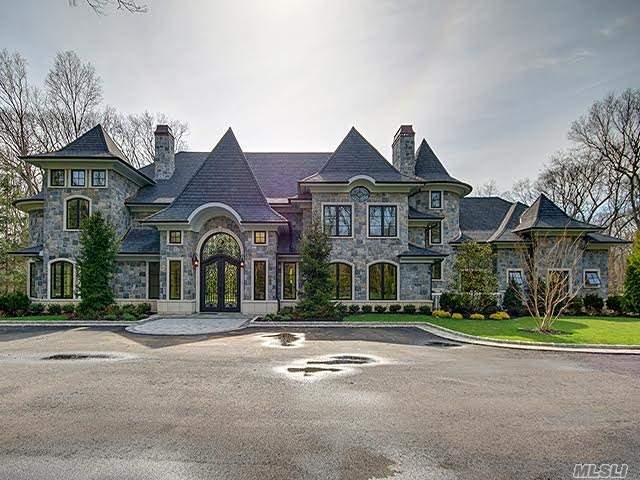 This Exquisite Custom Brick Col. Offers Approx. 7400 Sq Feet Of Luxury! An Expansive Foyer W/ Marble Floors, Breathtaking Mill Work, And An Astonishing Double Staircase Leads Into A Beautifully Expanded Gourmet Kitchen, Lg Living Rm, & Formal Dining Rm. Not To Mention An Elevator To 3 Lg Bdrm Suites, A Master Suite, And 3-Car Garage.