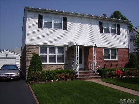 This Magnificent Expanded Cape Was Fully Dormered In 2001. First Floor Features Living Room, Dining Room, Updated Kitchen, 2 Nice Size Bedrooms, 1 Full Bath And An Enclosed Summer Porch. 2nd Fl Includes 3 Large Bedrooms And A Full Bath. The Basement Is Fully Finished With Half A Bath. Perfect For A Large Family. Walk To All.