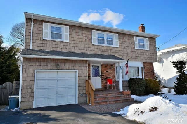 This Beautiful Center Hall Colonial Features Lg Lr W/French Doors To Fdr,  Eik,  Fam Rm W/0.5Bth And Sliders To Deck,  Lge Mbr W/Sep Bath,  3 Large Bedrooms,  Additional Full Bath,  New Roof And 200 Amp Electric,  Hi-Hats,  Private Fenced Yard,  Lg Brick Stoop,  2 Car Driveway. Great Location,  Walk To All...Must See!