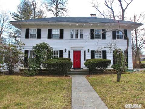 Sprawling Classic C/H Colonial. Grand Foyer Opens To Huge Formal Living Room With Fireplace Flanked By Built-In Corner Benches, And Formal Dining Room With Firplace. Two Dens Overlooking Deck And Huge Backyard. Back Stairway, High Ceilings & Many Architectural Details Throughout! Close To Town & Lirr -- Only 28 Minutes To Manhattan. A True Find!