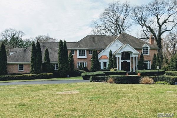 Grand Brick Colonial set on a Brookville cul-de-sac, 2 Acres... Huge Marble entrance leads to a newly redone foyer and staircase, Great rm with coiffured ceilings, fireplace, office, sunken lvr rm, Cherry wood & Granite Kitchenw/radiant, Stainless Steel Appliances, Floating Buffet or Bar. New Trex decking, Master suite with den and terrace.4-5 large addt bdrms. 3000 sq ft newly finished basement with bdrm, bath, cedar closet, tv room and 2nd staircase, new deck with pool. Neighborhood horse trails