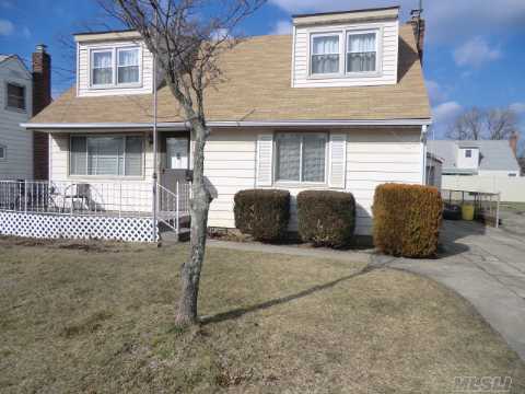 Welcome To Your New Home! This Large House Has 2 Large Front Dormers As Well As A Full Rear Dormer. The House Boasts A Sun Filled Eik W/Exit To Rear Patio, Beautiful Updated Bath,  Wood Floors, Gas Cooking + 5 Bedrooms One Being Approx. 23'X 11' All This And Priced To Sell!