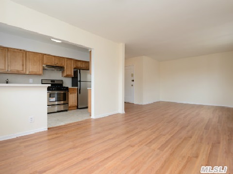 Spacious, Sunny And Cheerful Corner Unit. With Beautiful View Of Park-Like Common Area.  Renovations Just Completed. All New Floors,  New Windows & New Bathroom.  New Kitchen Open To Dining Room. Convenient (One-Block) To Rail Road, Bus And Shopping. Roslyn School District. Move Right In.Motivated Owner!