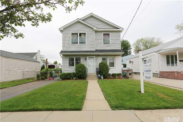 Beautiful Updated Colonial Conveniently Located Within Blocks Of Long Island's Finest Shopping, Dining, And Entertainment. New Kitchen, Bathrooms, Appliances, Roof, Oil Tank, Hot Water Heater, 200 Amp Electric Service, Driveway, And More.