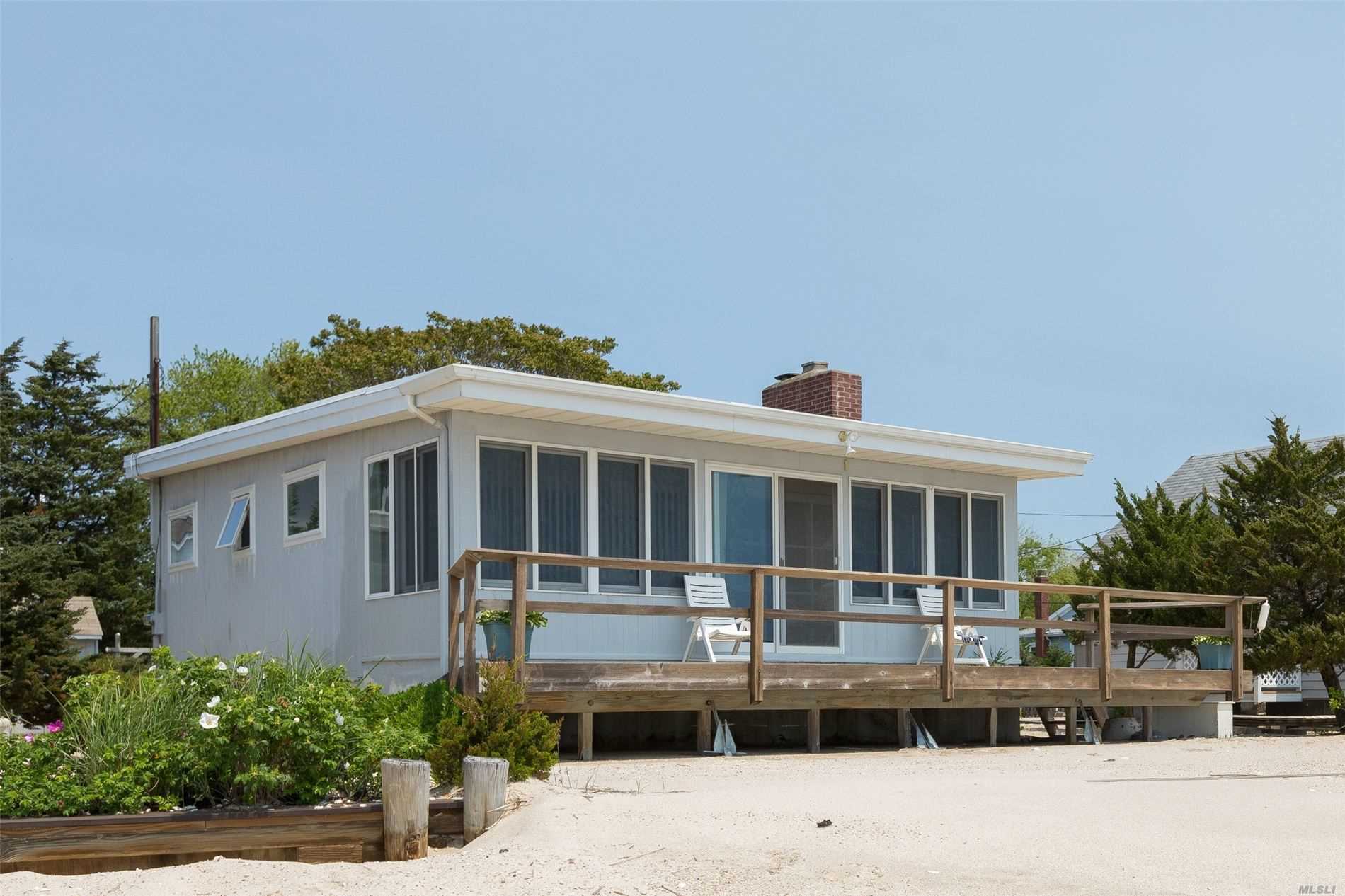 This is your waterfront location! Step outside your back porch and feel the sand between your toes with views straight across to the Hamptons. Fabulous location, great potential to make this property your dream home. Lovely cottage for your weekend get-away!!!
