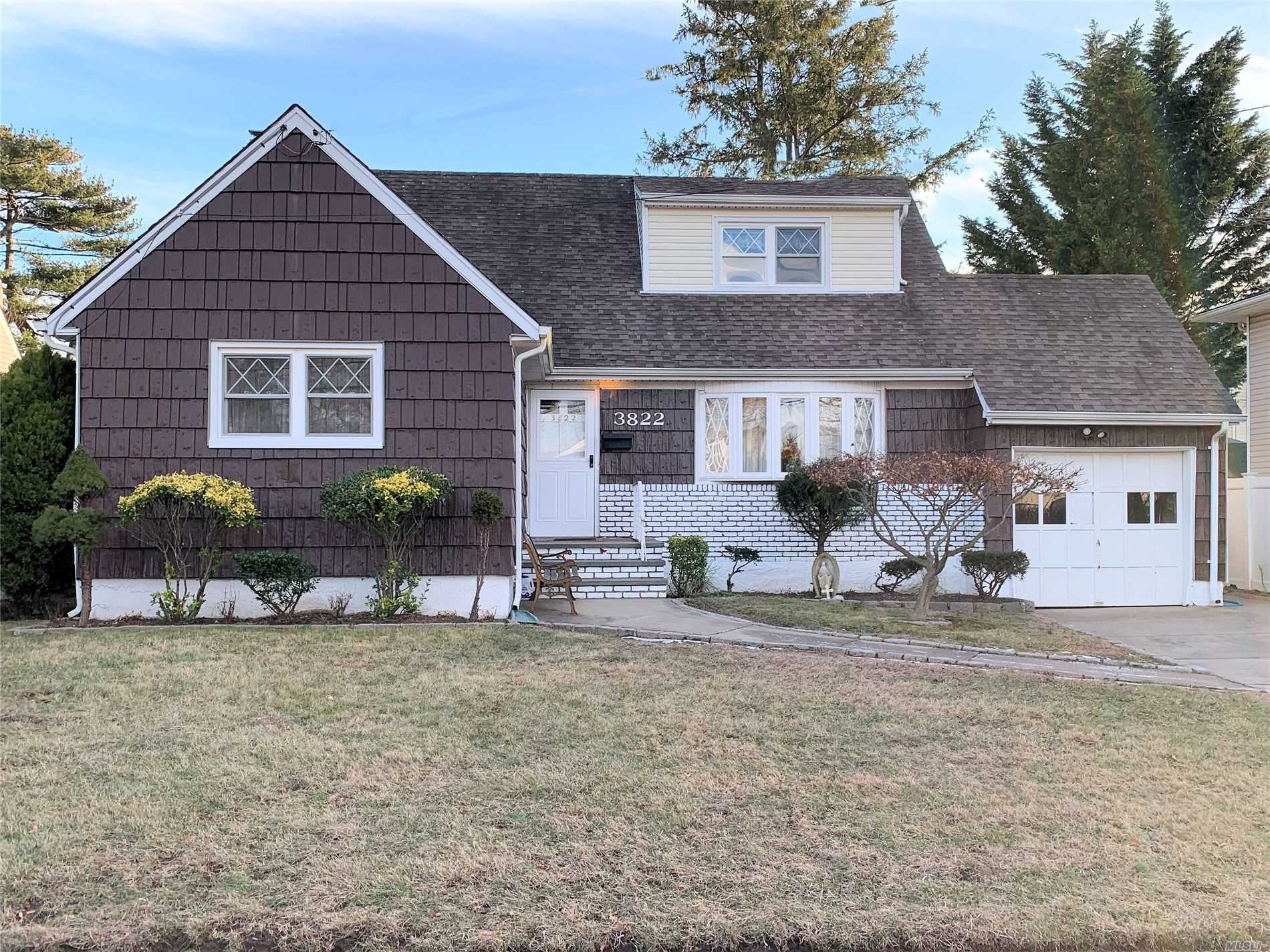 Prime Seaford location. updated windows.. oak floors.. two full baths..Large 3/4 finished basement w/dry bar.Master on the main level..Large dormer upstairs.. Updated heat system and oil tank. Deck off Kitchen as a gift. Walk to the railroad and near all major parkways..