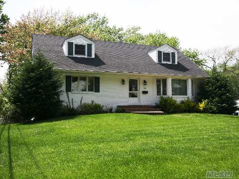 Beautifully Maintained 4 Br 2.5 Bath Flower Hill Cape, Convenient To Town And Lirr. Lr, Dr, Eik, 2 Br, 1 Bth On 1st Floor, +2 Large Brs And Full Bath On 2nd Floor. Fabulous Lower Level With Fireplace, Custom Built-Ins, Laundry Pwdr, Sliding Doors To Slate Patio. Deep Property, 2 Car Garage, Cac.