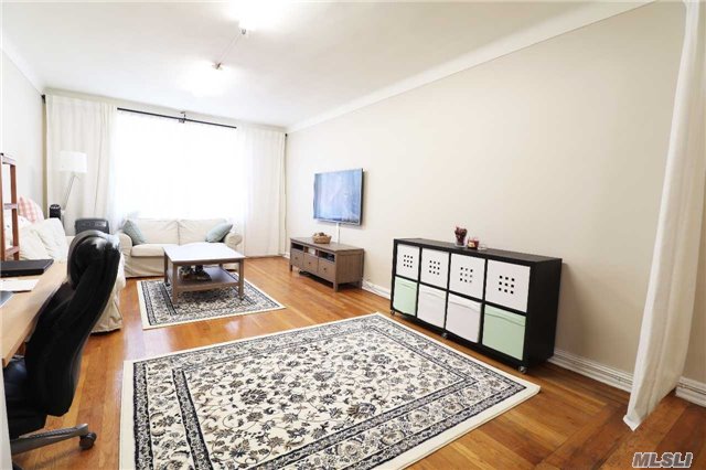 Specious One Bedroom Apt In Good Condition. South East Exposures, Bright Large Sunken Living Room, Large Bedroom, New Kitchen, . Hardwood Floors Throughout. Pre-War Building With English Gardens,  2 Blocks To Express Subway Station E F Line & Shopping. Zoned For Ps196 School.