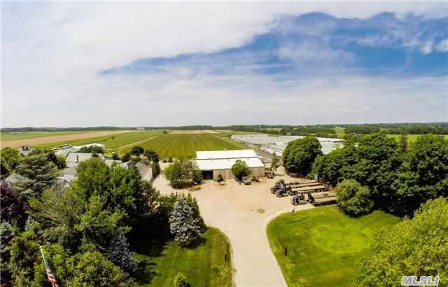 Picturesque Farm In Peconic. Come To The North Fork And Experience The Country Life. Working Farm W/ Great Visibility On Main Rd, Comprised Of Two Parcels. 2.2 Acres W/ Main House, Gar, 4 Outbuildings, And 25 Acres (Development Rights Sold) W/ 2 Barns, Irrigation Well & Pump. Leave The Suburbs Behind.