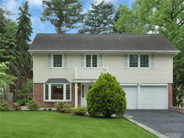 Lovely 4 Bedroom Colonial Completely Updated. Spacious Family Room With Wood Burning Fireplace, Large Size Dinning Room, Living Room With Cathedral Ceilings And Skylights. Beautifully Renovated Eat-In-Kitchen. Master Suite With Over Sized Walk In Closet, Three Additional Bedrooms And Hall Bath. Conveniently Located To Town, School And Lirr.