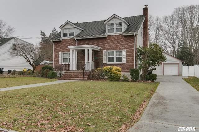 4 Br 2 Bth.New England Style Home Of Brick & Stucco. Move In Condition. Huge Living Rm,  Dining Rm W/Oak Flooring,  Eik,  Br On 1st Level,  3 Brs On 2nd Level. New Concrete Driveway And Walk Ways. Mechanic Or Handyman's Dream Oversize 2 Car Det Garage.75X200 Lot