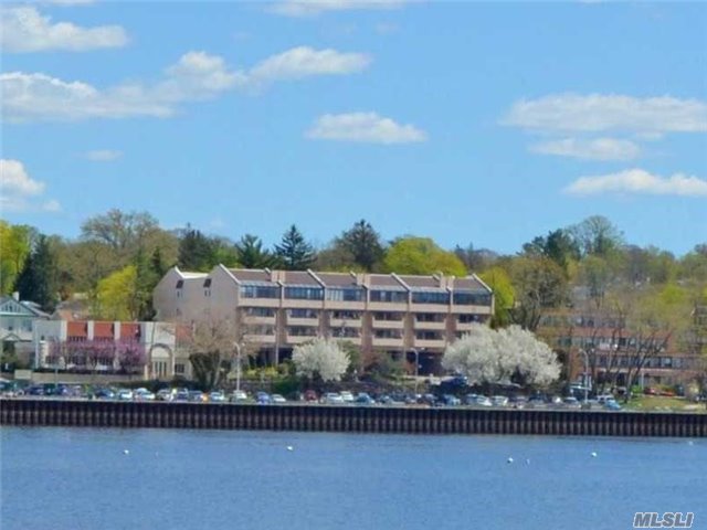 Senior Condo, 62+, Opposite The Town Dock. Desirable Elevator Building With With Fabulous Waterfront Community With Close Shopping And Dining. Quiet First Floor Rear Unit With Balcony Across Lr & Mbr. Parking Space Included.