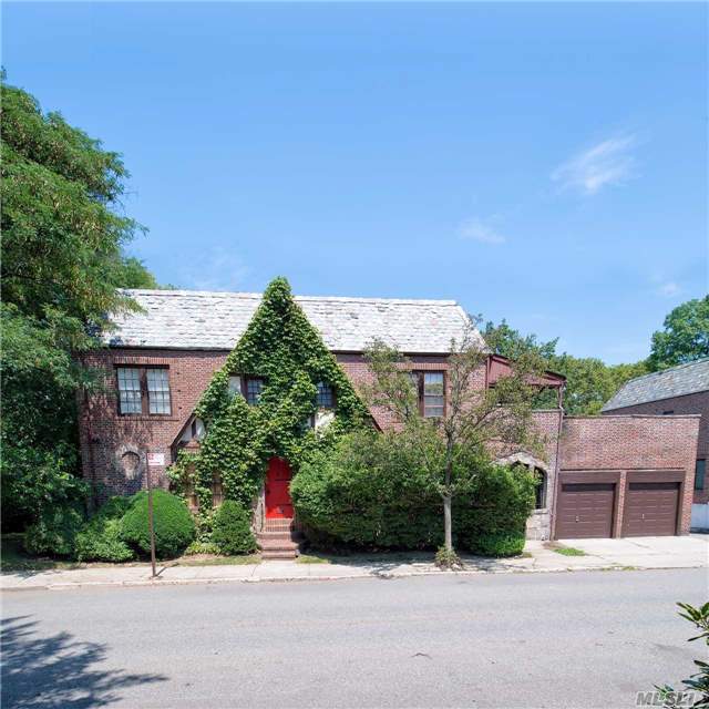 Charming Tudor Located In The Heart Of Forest Hills. This Home Features A Grand Living Room With Fireplace, Dining Room, Kitchen, 2.5 Baths And A Full Finished Basement. Entertain On Your Own Private Terrace. Located Near All Parkways And Public Transportation. Parking Gem Which Features A Two Car Garage. Come View This Unique Home. Won't Last!
