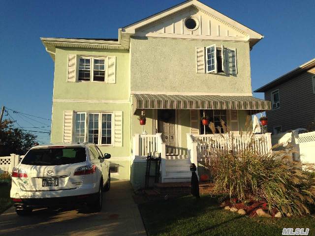 Gorgeous Expanded Colonial W/Parklike Back & Side Yard. Beautiful Expansion,  2 New Large Full Baths,  Mud Room,  Laundry Rm Upstairs,  Outside Covered Bar,  New Trek Decking.  Master Br W/Dressing Rm & Wic,  2Bedrooms,  Large Den/Family Room,  New Utilities,  New Roof,  Private Driveway.  A Must See Home!!