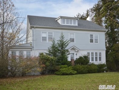 Beautiful Vintage Colonial Overlooking Lake In Brightwaters. Built In 1910 W/4100 Sq.Ft. Featuring Entry Foyer,  Formal Living Rm W/Wb Fpl,  Sunroom,  Formal Dining Rm,  Eat In Kitchen,  Bkfast Rm,  Half Bth On 1st Fl. 2nd Fl Features 4 Bedrooms,  2 Full Baths.3rd Fl. Features 2 Bedrooms.Full Semi-Finished Bsmt W/W&D,  Ig Vinyl Pool,  Brick Patio,  2 Car Det Garage,  Shy 3/4 Of Acre.