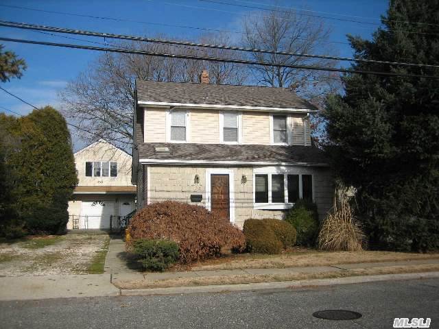 Charming Colonial Centrally Located In Hicksville. Home Situated On A Quiet Block. Huge Eik Highlights This Home That Has A Basement And Detached Garage. Detached Garage Has A Spacious Loft About That Is Completely Finished. Walk To Shopping,  Houses Of Worship And Bus Stop And Hub Train Stop.