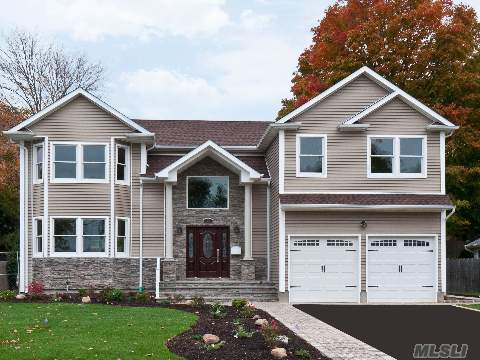 Magnificent Center Hall Colonial, Featuring 5 Bedrooms, 4.5 Bathrooms. Oversized Property. Hardwood Floors, State-Of-The-Art Kitchen, Moldings Throughout. Village Elementary & Southwoods Middle School.