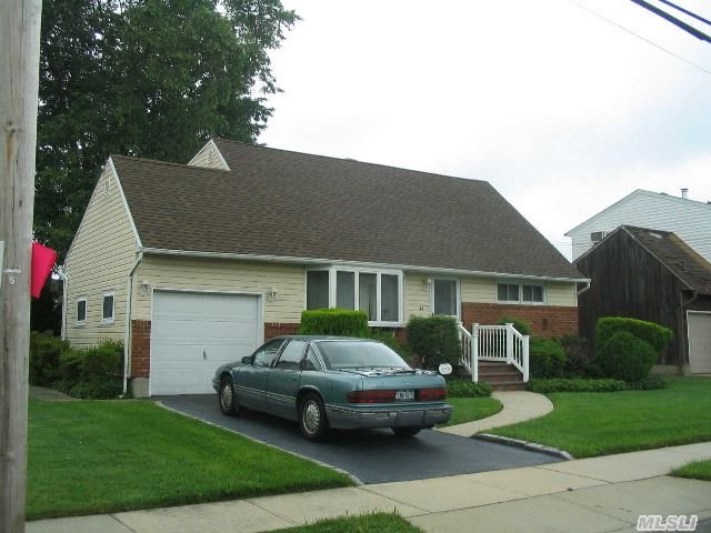 Beautiful Dormered Cape Featuring 4Bedrooms,  2 Baths,  Lr/Dr,  Kitchen. Full Bsmnt,  Finished . Rec Room.   Hardwood Floors,  150 Amp Electric,  Gas Heat & Hot Water. Dining Area Has Sliders To Large Deck. Inground Sprinklers. Attached 1 Car Garage. Great For Entertaining.  This Home Is A Must See.