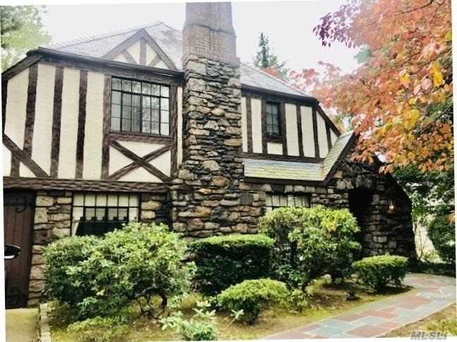 Charming Stone and Stucco English Tudor with loads of potential on oversized lot (60 x 140) in N. Strathmore. New CAC compressor (2 years old)