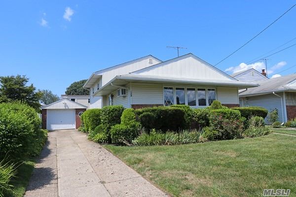 Fantastic Split Level Featuring LR & FDR w/ Cathedral Ceilings, Large EIK, First Flr: Big & Spacious Family Rm, Powder Rm, Laundry/Utilities, OSE, 3rd Flr: Master Bedroom, 2 Family Size Bedrooms, Full Bath, 1.5 Detached Garage, 50x100 Lot, New HW Heater, Beautiful Hardwood Floors. Close to Shopping, LIRR & Community Pool! A Must See!