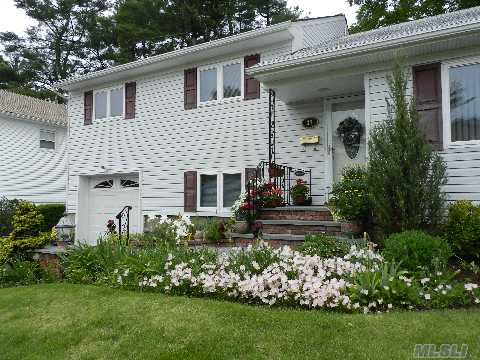 Maticulously Maintained Split Level Located In The Syosset Schools. Updated Kitchen & Baths, Hardwood Flrs Throughout Home. Lovely Enclosed Porch. Offers Possibilities. Taxes Exclude Star Exp. $1336.40