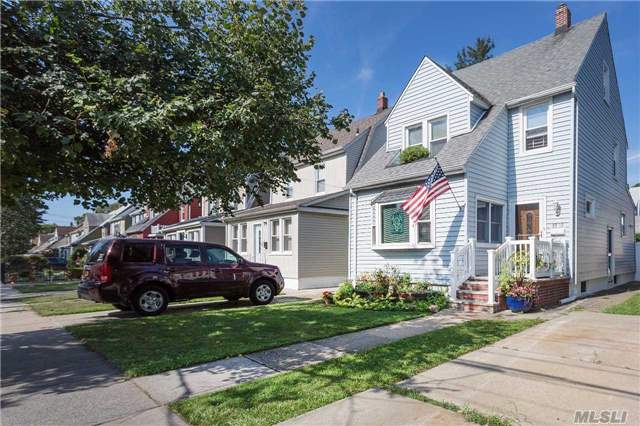 Updated Colonial Min Away Fm Restaurants, Schools & Lirr. Rare Full Staircase Off Upstairs Hallway Walk Up Attic Currently Being Used As 4th Br. Lg Lr, Fdr & New Eik. Single Layer Roof & Windows 9 Years Old, Boiler & Hw Heater 5 Years Old, New Fdr Ac. Utilities, Washer/Dryer & Extra As Is Fridge/Freezer Located In Full Finished Basement. Zoned X-No Flood Insurance.