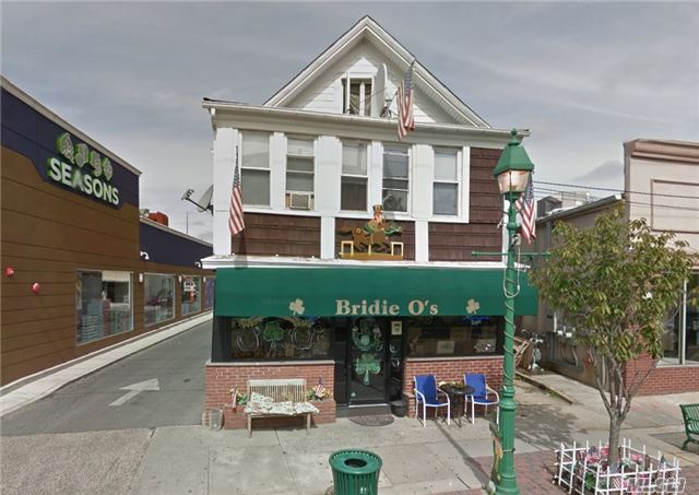 Free Standing Building   Lot Size - 31'W X 142'D   3 Apartments Upstairs  1st Floor Bar & Grill  Warehouse In Rear Bldg Has 3 Floors + Basement On-Site Parking In Rear Adjacent To Municipal Lots Trophy Location, High Visibility Near Lirr & Public Transportation