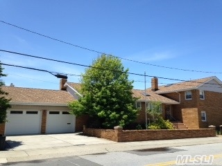 High & Dry--This House Was Not Touched By Sandy. Custom-Built Brick Split On 5 Lots With 2-Car Garage & Inground Pool.  Open Livingrm-Diningrm-Den W/Skylite & Woodburning Fireplace. 1st Floor Family Rm Has Summer Kitchen,  Guest Bedroom & Bath..Sliding Doors Open To Pond-Shaped In-Ground Pool & Fully Awning-Ed Pooldeck. A Fabulous Oasis Just 1 Block From Private Ocean Beach