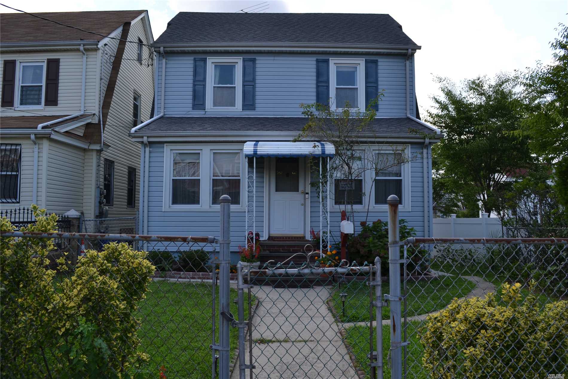 An Excellent Corner Property With Lots Of Update, Presenting 3 Bedrooms, Dining Rm, Living Rm, Kitchen 2.5 Bath, Porch 2 Indoor Garage, Convenience To Bus Q1, Q36, Q77, Q43 & Q76 & Nassau Express Bus.Near All