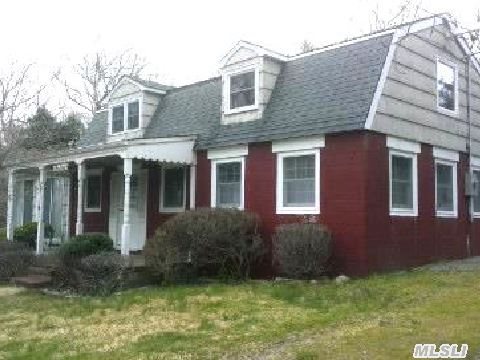 Original Cottage Converted Barn Sits Atop One Very Private Wooded Acre. Gambrel Roof, Open Floor Plan, Fieldstone Fireplace. Deeded Access To Nassau Pt Beach! Endless Possibilities For Expansion At This Wonderful Location!