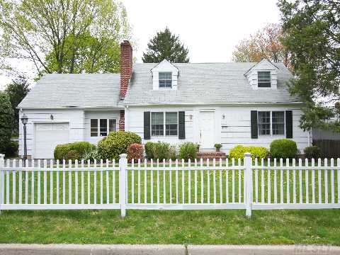 Charming Cape With Picture Perfect Location. Renovated Kitchen & Baths. Hardwood Floors Thru Out. Fireplace In Living Room. Formal Dining Room W/French Doors Out To Huge Deck.  Fabulous Backyard & Finished Basement-Laundryroom.