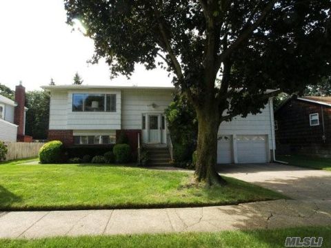 Great Opportunity To Own In Syosset.  Spacious Home Featuring Updated Eat In Kitchen With Access To Backyard, Formal Dining Room, 4 Bedrooms On Top Level, With Family Room And Additional Office Room On Lower Level, Large Laundry Room, Updated   Full Bath And Access To 2 Car Garage With Lots Of Storage Space,Covered Porch.