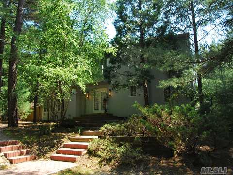 Seclusion, Privacy And Wooded Splendor Surround This 3 Bedroom Salt Box Contemporary With Deck And Pool.  The Open And Sun Drenched Eat In Kitchen , Dining Area, Great Room As Well As Living Room Look Out On The In Ground Pool And Lush Wooded Landscape. Amazing Grounds And Near All The Hamptons Have To Offer Make This A Great Vacation Or Year Round Residence! 