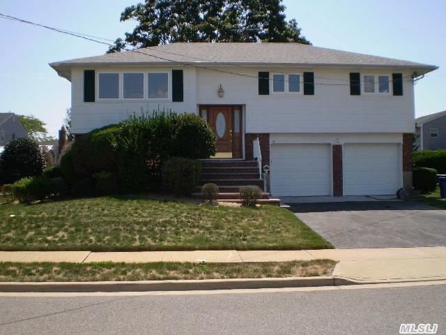 Massapequa Shores Hi Ranch Mostly All Redone Features 4 Bdrms,  Kitchen W/Granite Counter Tops And New Appliances,  2 New Baths,  All Hardwood Floors,  New Cac,  New Oil Tank,  New Windows,  New Burner