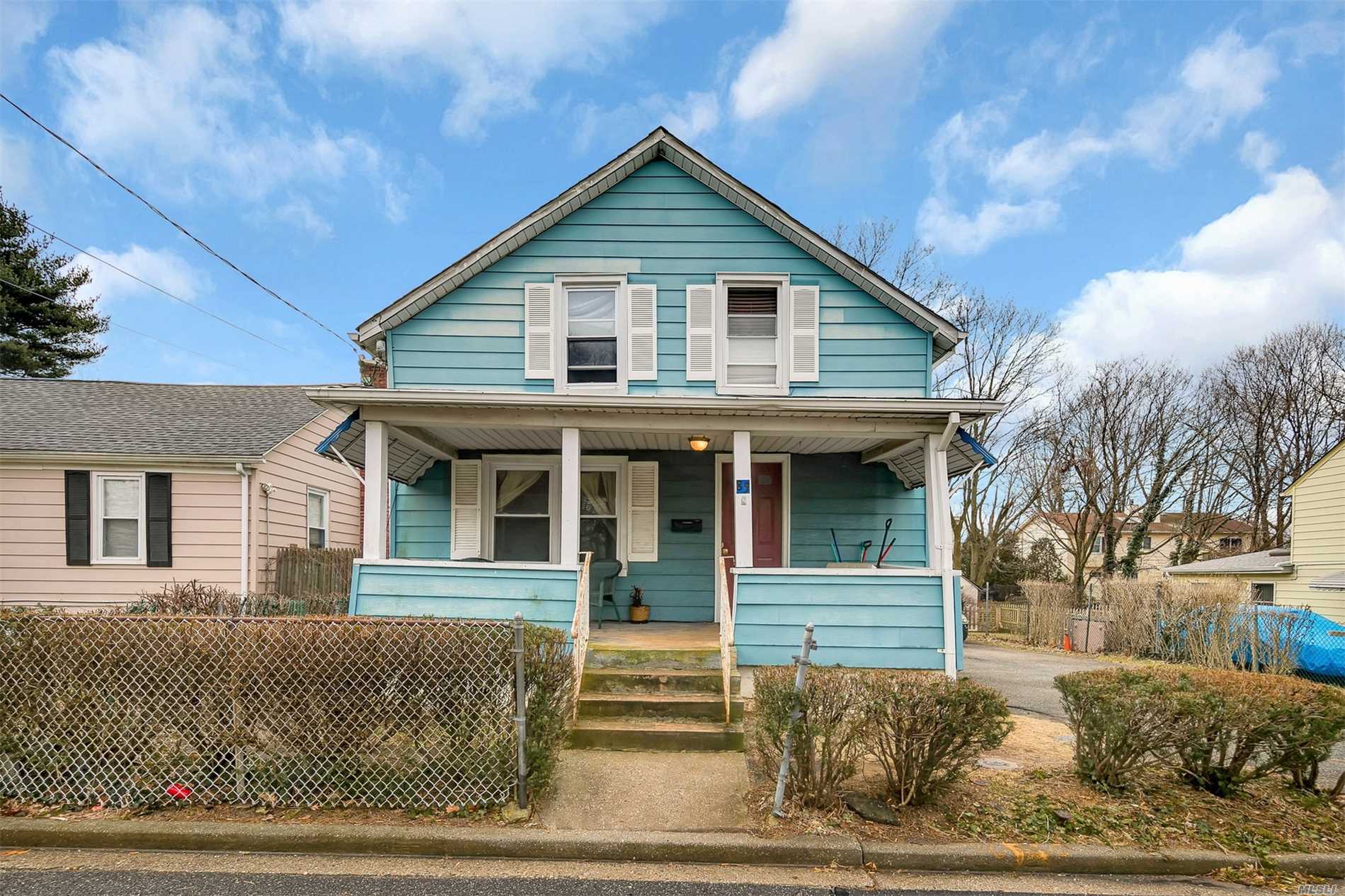 Sun-Filled Charming Colonial, Three Bedroom, One Bath Home Situated On A Quiet Mid Block Street. Parking For Six Cars, Annual Rental Income $28, 800. Perfect Starter Home In Locust Valley Schools. Sold As Is.