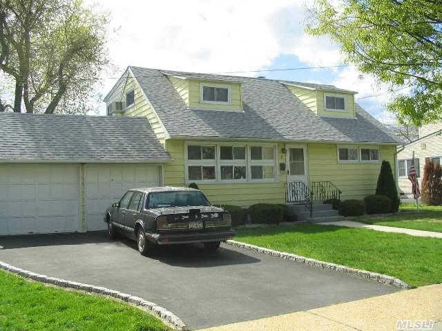 Expanded Rear Dormered Cape With 2 Front Window Dormers. Home Features Kitchen,  Lr/Dr,  Den,  2Baths 5 Br.