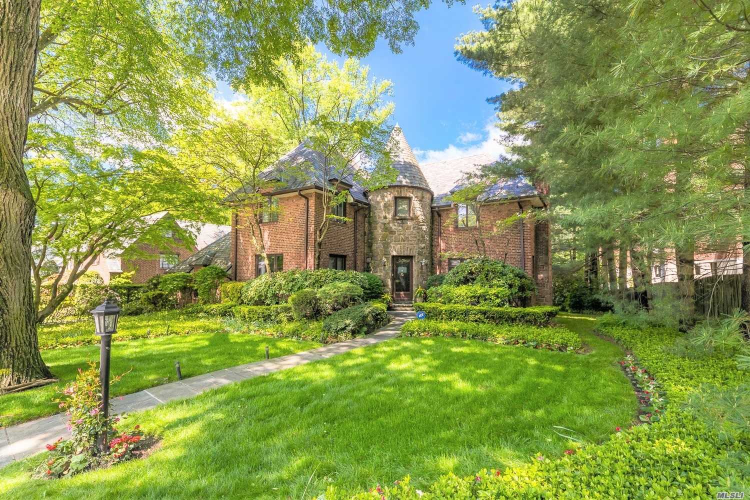 Huge Price Adjustment! Buy in time to register for schools in September! Rare brick Tudor in exclusive Russell Gardens! Great Neck South Schools! A Commuter&rsquo;s Dream - 10 mins to LIRR, 1/2 hr to Penn Station! Huge sunken living rm w/10 ft ceilings & fireplace, formal D/R, 376 sq ft EIK w/stainless steel appliances, master BR w/full bath featuring whirlpool tub, steam shower, 3 other large BR&rsquo;s, full bath upstairs. Full finished bsmt with guest room & bath. Pvt park w/heated pool and tennis courts