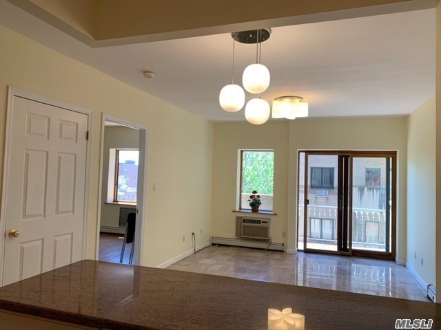 Flushing most desirable location, Corner UNIT w/Balcony, 24 hr doorman , Near #7 Subway & shopping& Restaurant .Com charges incl heating.Mint condition