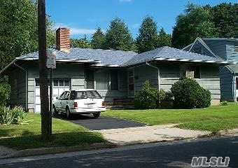 Ranch-Style House Situated On A Large, Flat Property That Is Conveniently Located Within Walking Distance To Shops, Restaurants, Parks, Lirr And Lakeville Elementary School.The Ground Level Of This Home Features Hardwood Floors Throughout, A Living Room With A Fireplace And A Formal Dining Room.Kitchen Has Updated Stainless Steel Refrigerator And Stove With Breakfast Area.