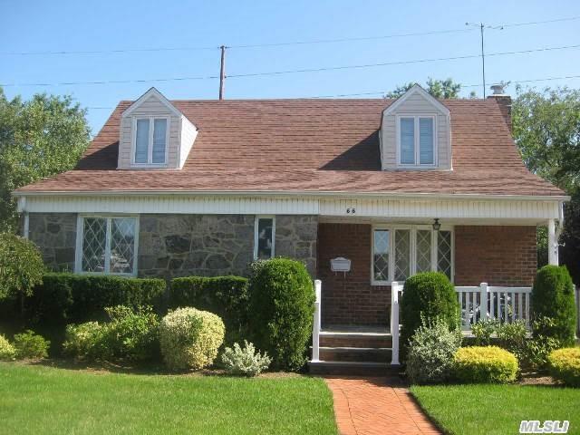 This Home Is A Brick And Stone Wide-Line-Cape In Prestigious Herricks School District. It Is Half Dormered W/ Anderson Windows. It Has An Updated Kitchen,  Living Room & Dining Room,  4 Bedrooms & 2 Full Baths,  1 Bath Is Updated. The Walkway & Front Porch Have Been Redone. The House Has A Full Unfinished Basement & Detached Garage,  Near To Transportation & Shopping.