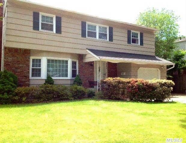 True Center Hall Colonial Feauting King Sized Master Bedroom Suite With Wik,  3 Other Large Bdrms Updated Eik W/Center Island. 2 1/2 Updated Baths,  Updated Windows. Den/Office W/Entrance To Backyard,  Close To Lirr And Village Shopping.