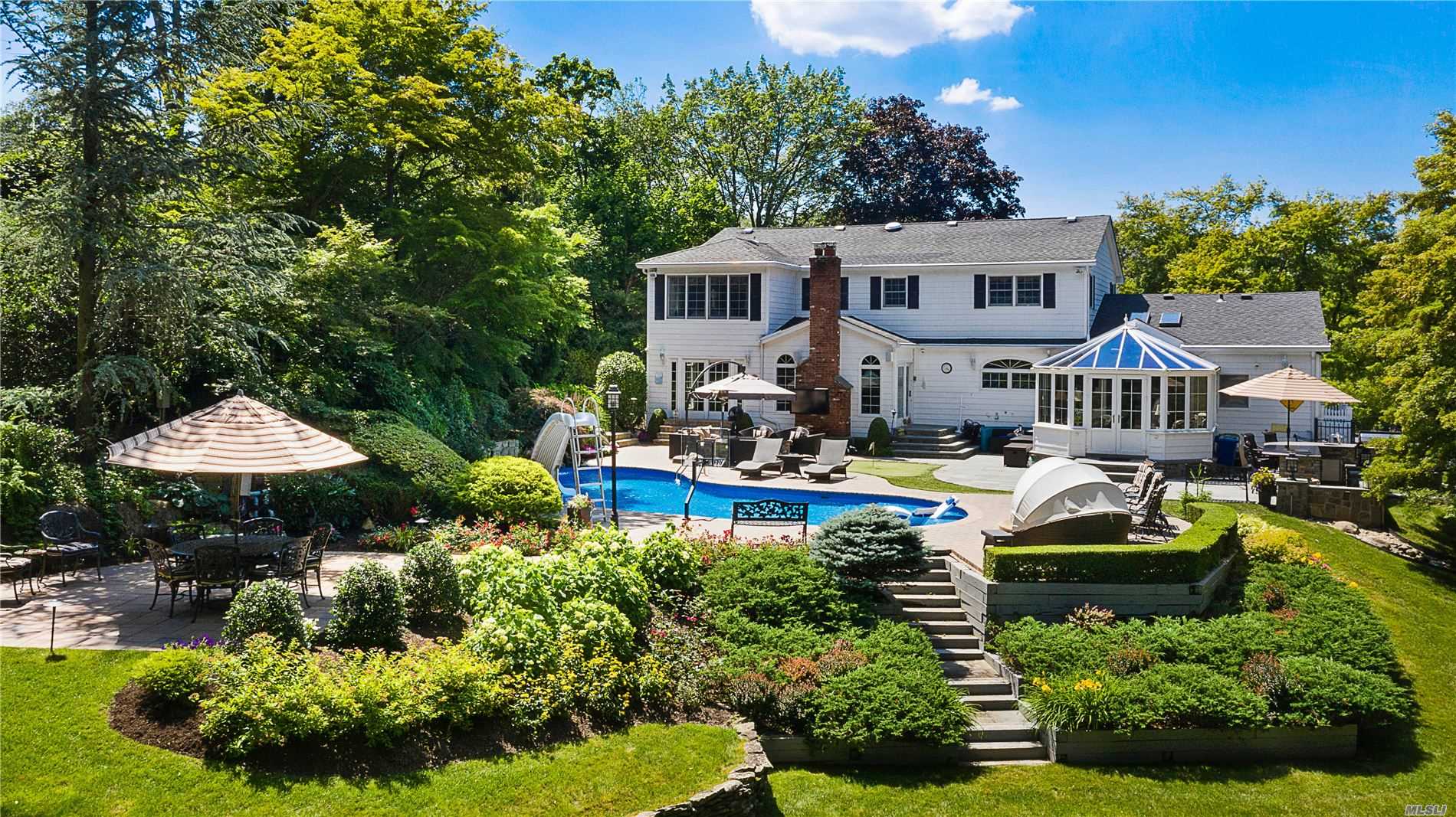 Meticulously Maintained 4 BR, 3 & 1/2 Bath Center Hall Colonial in Syosset School District, Boasts Brand New Wide-Plank Wood Floors, Family Rm, Formal Dining Rm, Kitchen w. Granite Counters & Gas Stove & Stunning Sunroom w. Add. Gas Fireplace. Master BR Suite w. Walk in Closet. Pre-Wired w. Sonos Music System & 5 Zone A/C & 4 Zone Heat. Finished Full Basement Including Half Bath. Country Club-Like Backyard Complete w. Salt Water Pool, Outdoor Kitchen, TV & Personal Putting Green. Will Not Last!