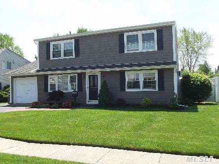 Totally Renovated Colonial With New Vanilla Maple Cabinets And Granite Counters-All New Windows-Hardwood Floors-Pvc Fence-Brick Work-New Washer And Dryer-Clean As A Whistle-Just Move Into This Awesome Mid-Block Colonial-Taxes Do Not Reflect Star.