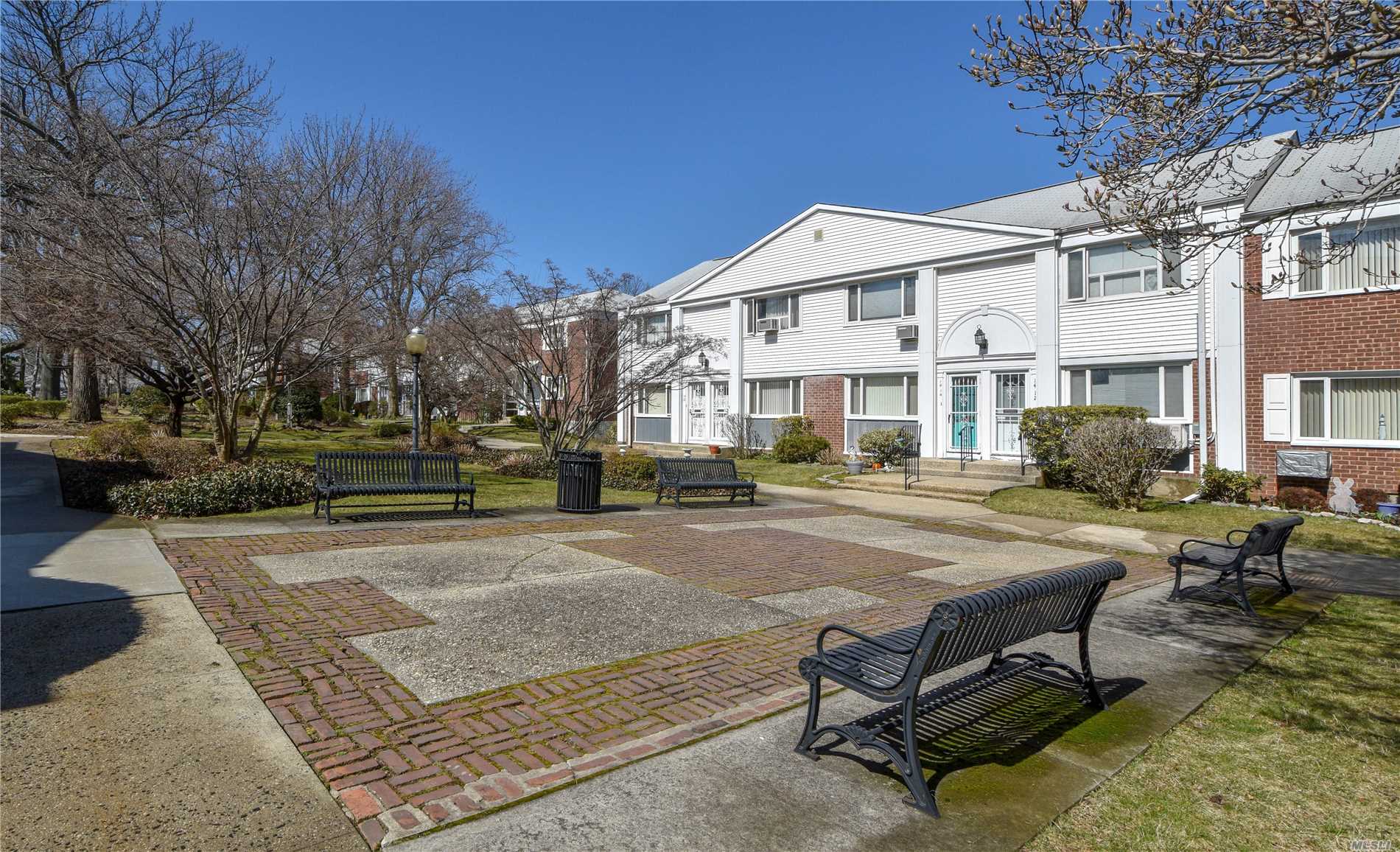 Rare Find! Diamond Corner Unit Duplex Features Open Floor Plan W/ 2 Bdrms, 1.5 Bths Including 1st Floor Bth, Designer Kitchen W/Quartz Countertops, Stainless Appls, Center Island, Hardwood Laminate Floors Thru-Out, Private Patio For Entertaining, Moments Fort Totten Park, Maintenance Includes Electric, Heat, Hot Water, Taxes, And Garbage Removal. 1 Designated Off Street Parking Plus Garage Available. A Must See!