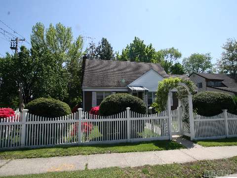 Charming Cape W/Brick & Siding On Large Corner Property With Beautiful Custom Fencing. 4 Br's, 2 Baths, Hw Floors, New Heat, New Electric, Walk To Elementary School. Best Buy In Port Washington!