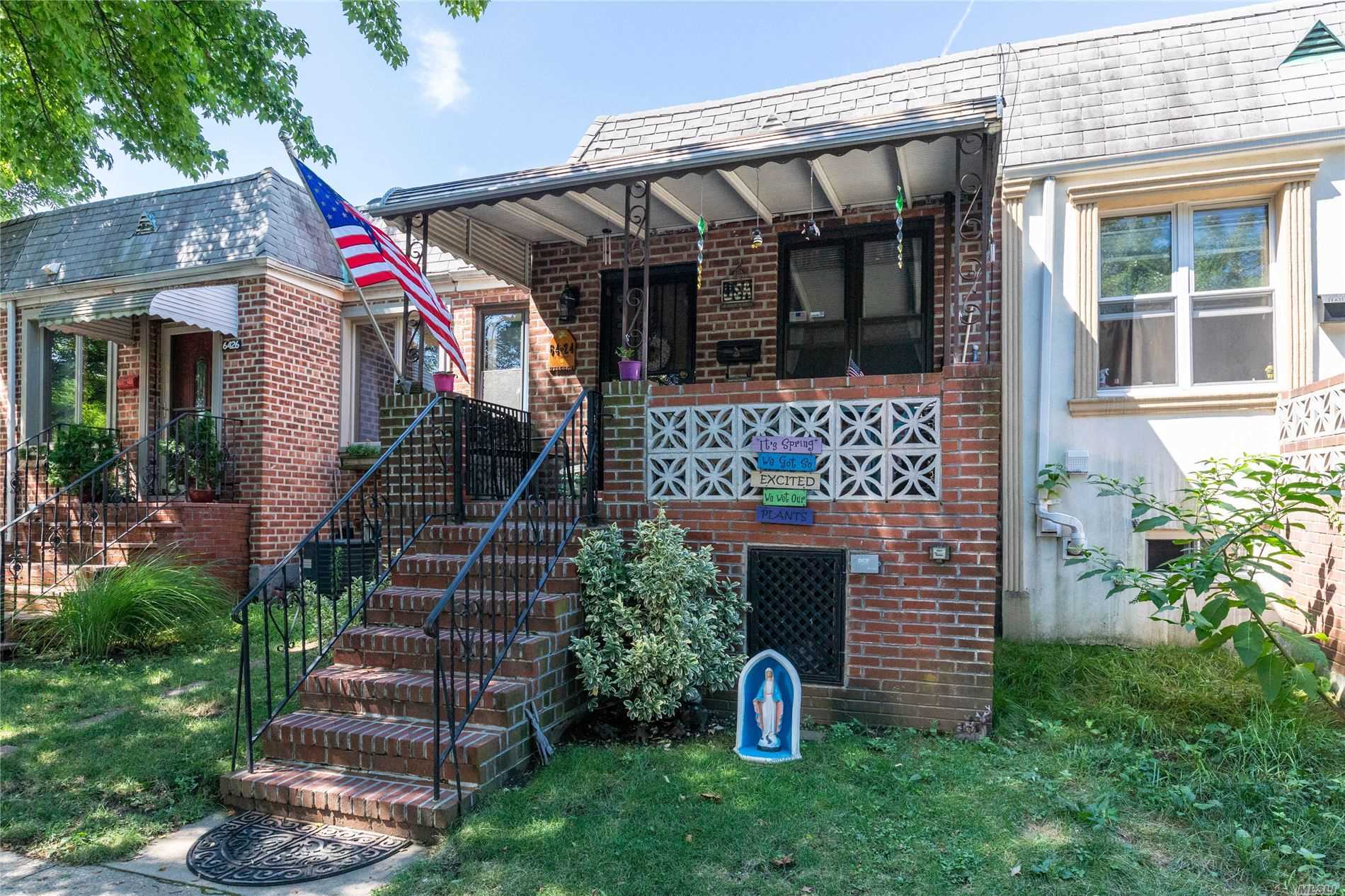 Desirable MIddle Village 2 Bedroom Brick Attached Ranch-Meticulously Maintained. This House Has An Eat In Kitchen, Hardwood Floors, New Bath, Finished Basement With Ideal Family Room, Laundry Room, And Access To Backyard And Patio.